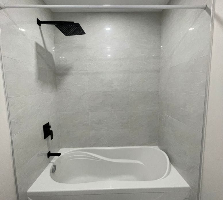New soaker tub with matte black shower hardware installed